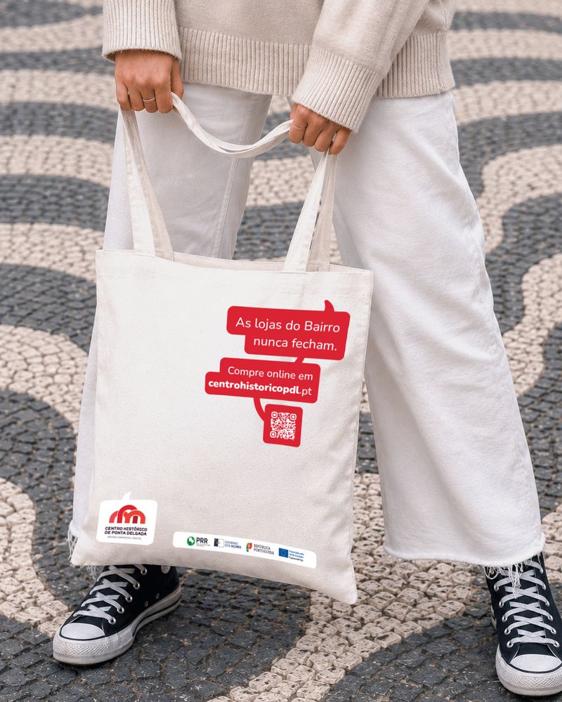 Tote bag do Bairro Comercial Digital, com balão de fala a destacar uma vantagem do bairro